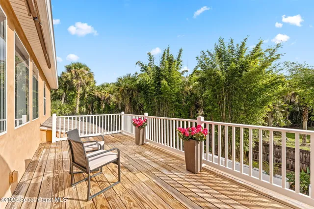 an empty room with window and ceiling fan