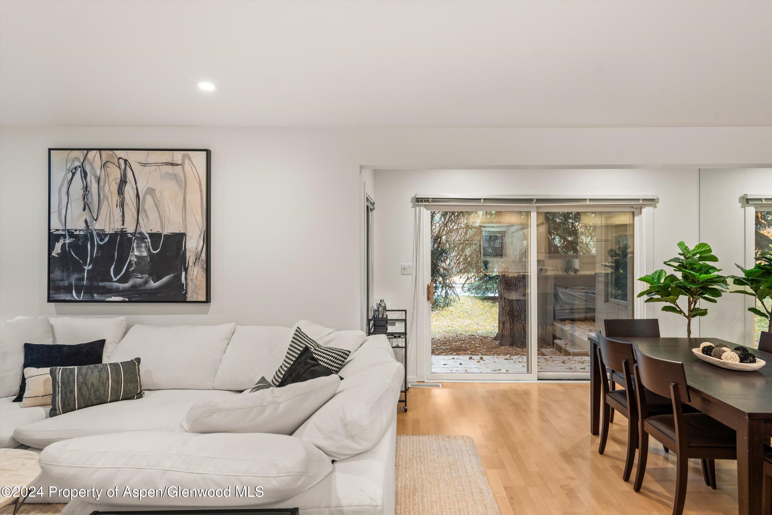 814 West Bleeker Street, Unit D1 Aspen, CO 81611 - Photo 5 of 22 a living room with furniture and a large window