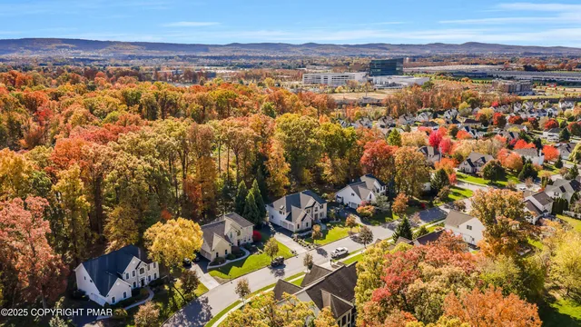a view of a livingroom with a fireplace and window