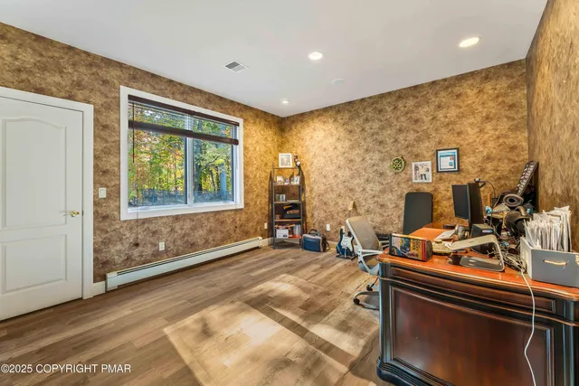 a bathroom with a sink mirror and a shower