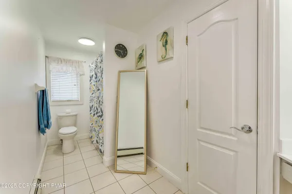 a bathroom with a bathtub and shower