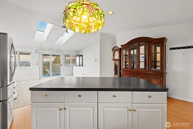 a kitchen with a sink and a cabinet