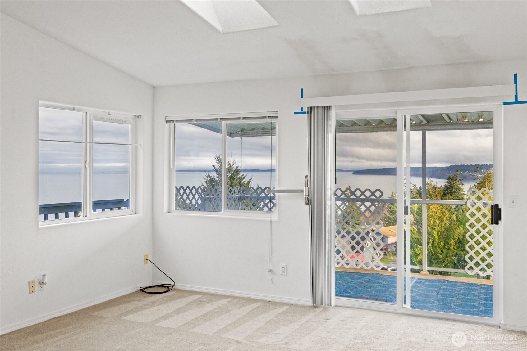 233 Lupine Drive Sequim, WA 98382 - Photo 17 of 40 an empty room with windows and entrance