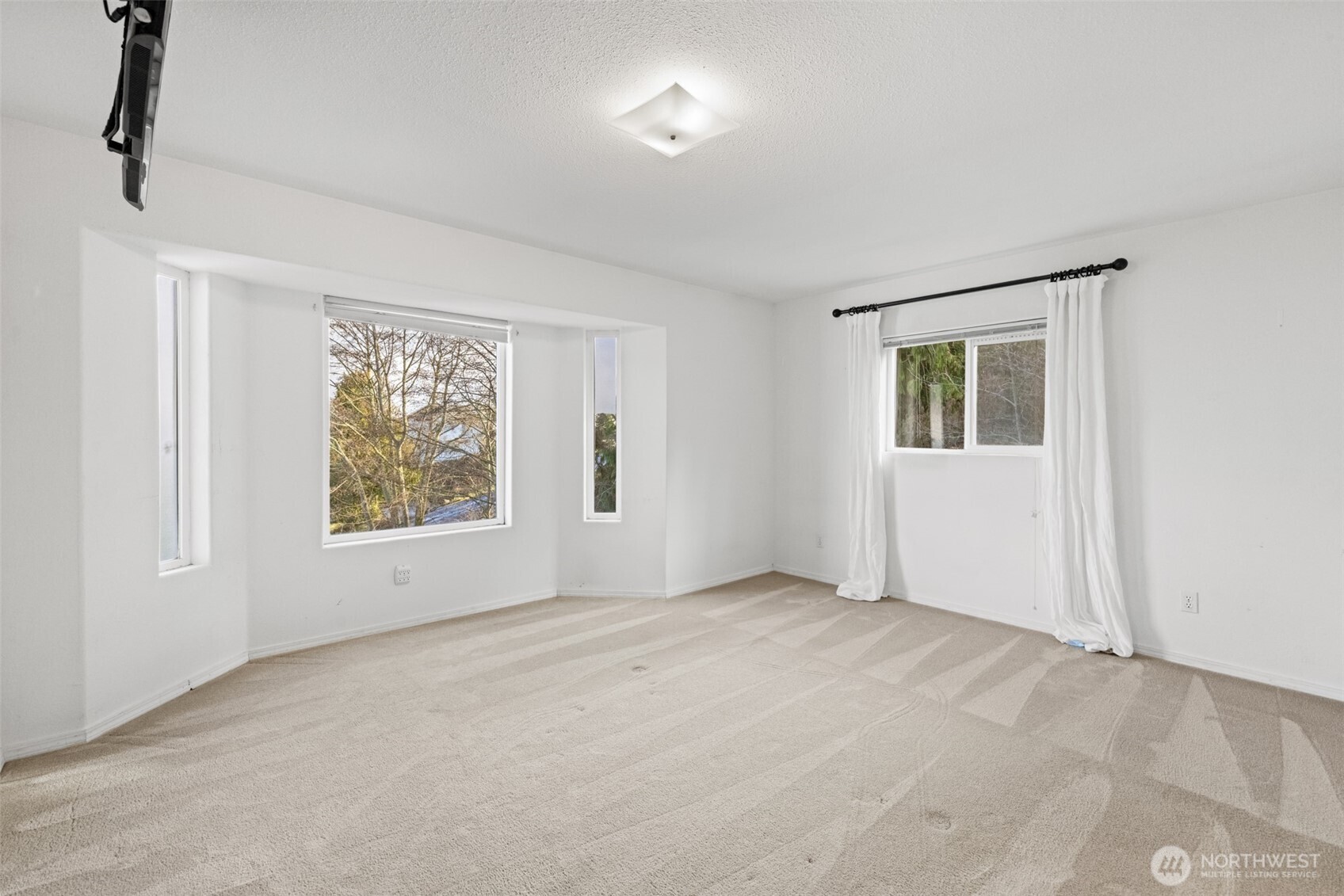 233 Lupine Drive Sequim, WA 98382 - Photo 19 of 40 a view of an empty room with a window