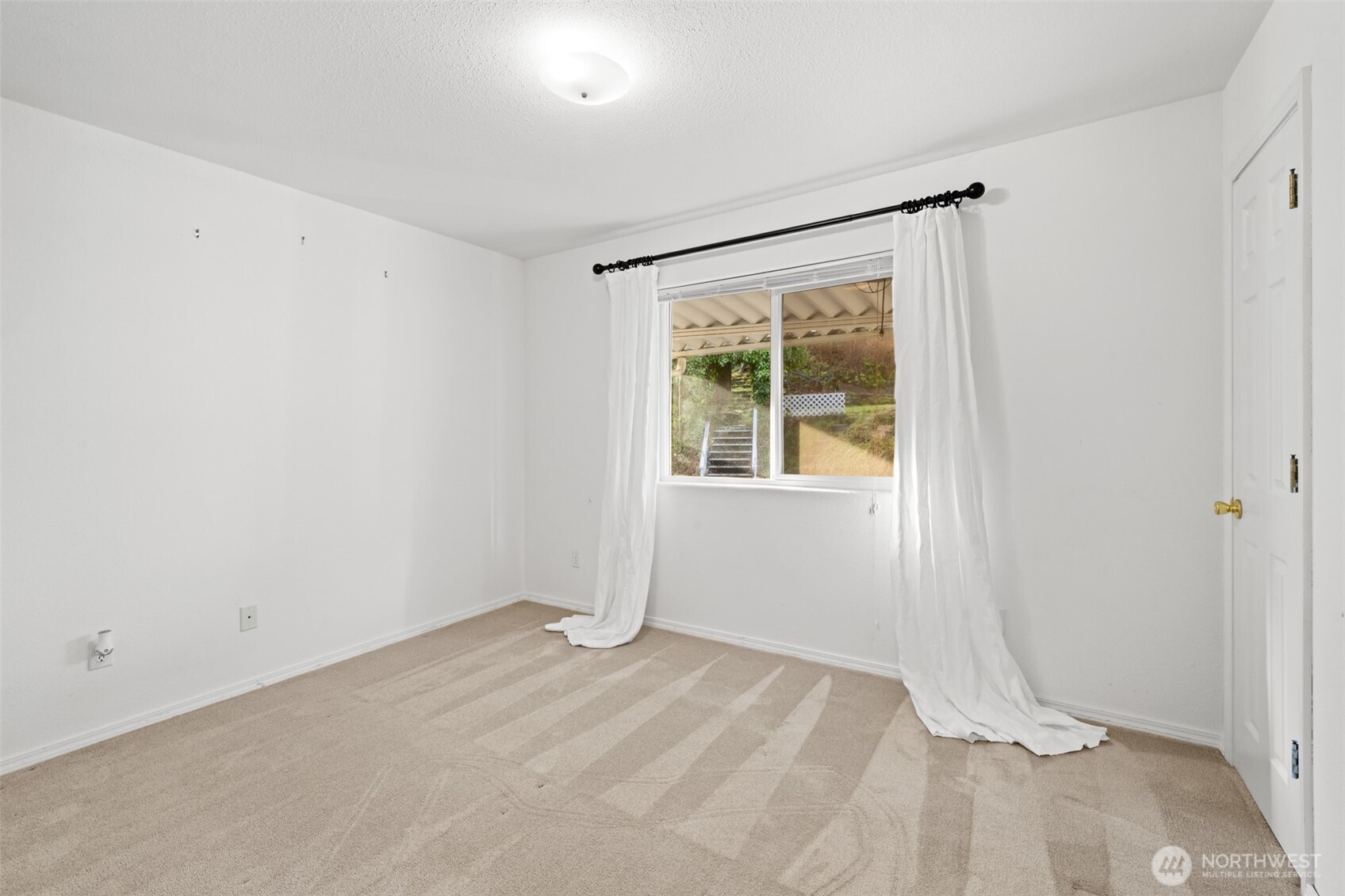 233 Lupine Drive Sequim, WA 98382 - Photo 24 of 40 an empty room with a window