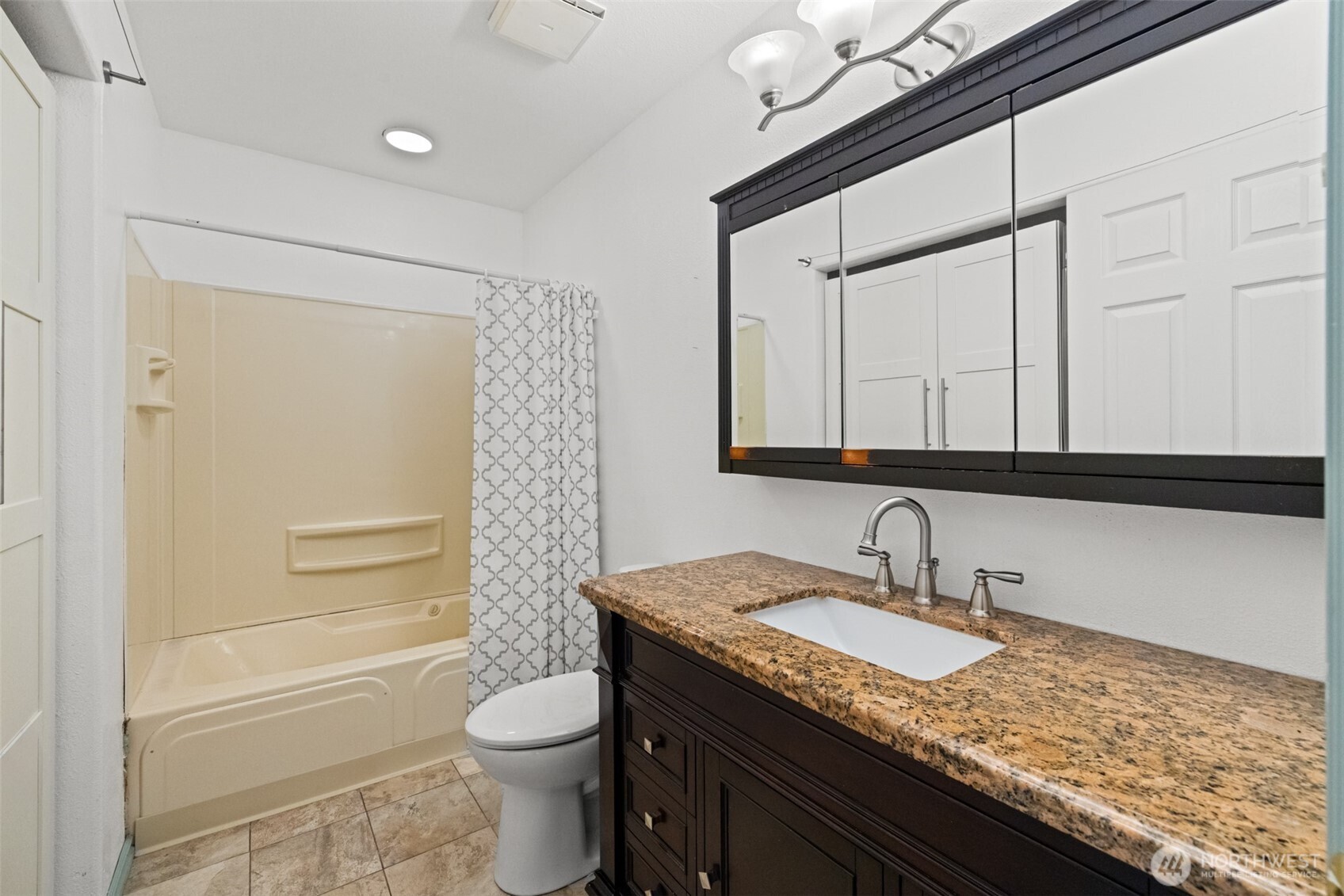 233 Lupine Drive Sequim, WA 98382 - Photo 26 of 40 a bathroom with a granite countertop sink toilet and shower