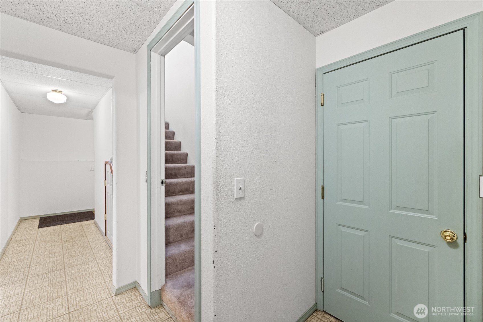 233 Lupine Drive Sequim, WA 98382 - Photo 29 of 40 a view of a hallway with wooden floor and staircase