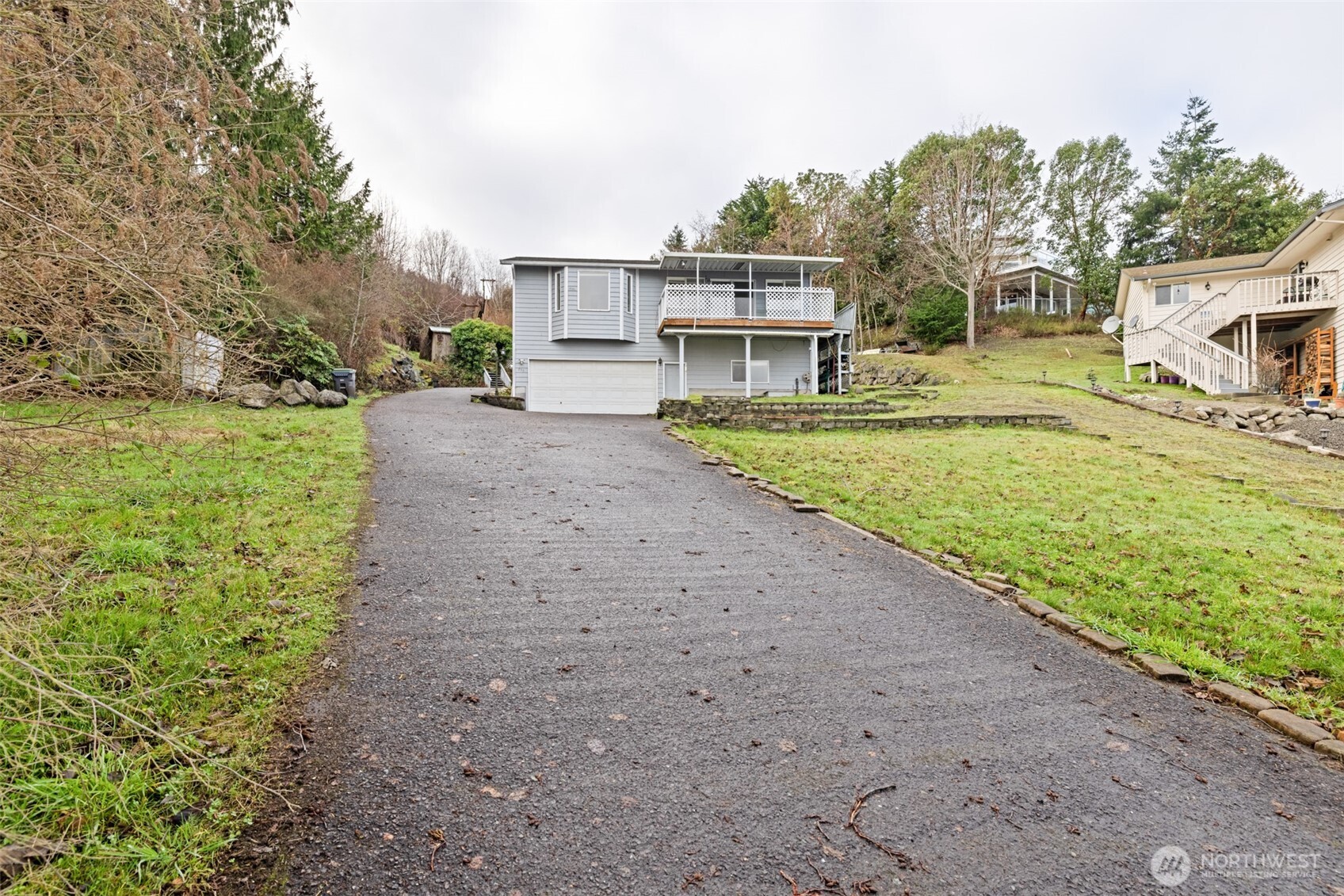 233 Lupine Drive Sequim, WA 98382 - Photo 38 of 40 a view of a house with a yard and sitting area