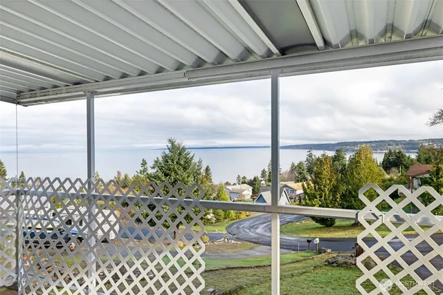 a view of a balcony with lake view