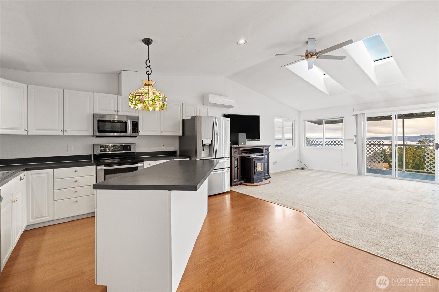 233 Lupine Drive Sequim, WA 98382 - Photo 9 of 40 a kitchen with granite countertop a stove a oven a sink a counter top space and cabinets