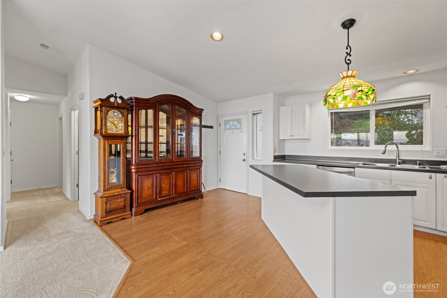 233 Lupine Drive Sequim, WA 98382 - Photo 10 of 40 a kitchen with stainless steel appliances granite countertop a stove a sink and a chandelier