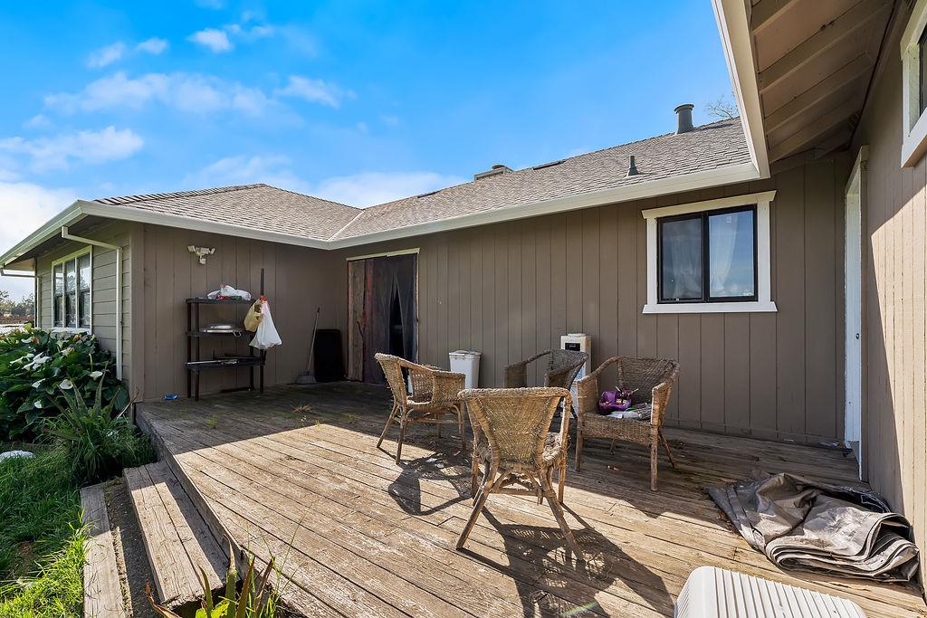 Irwin Lane Santa Rosa, CA 95401 - Photo 20 of 35 a view of a patio with table and chairs and potted plants