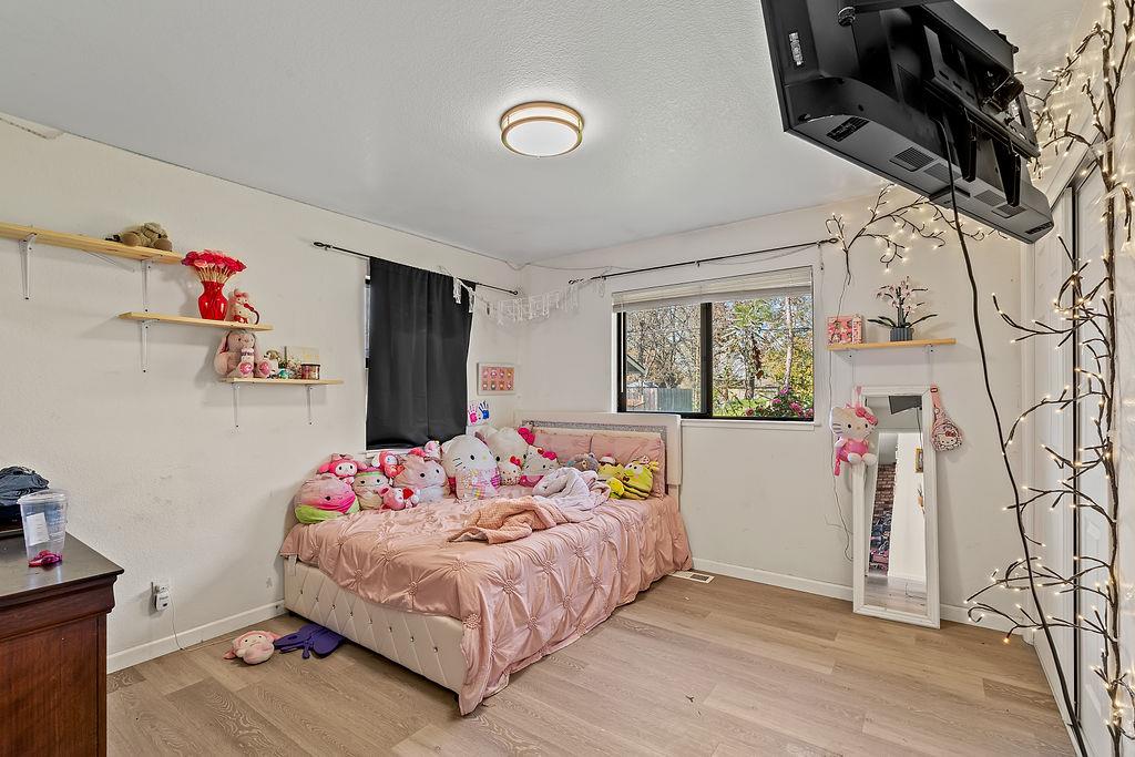 Irwin Lane Santa Rosa, CA 95401 - Photo 28 of 35 a bedroom with a bed and a window