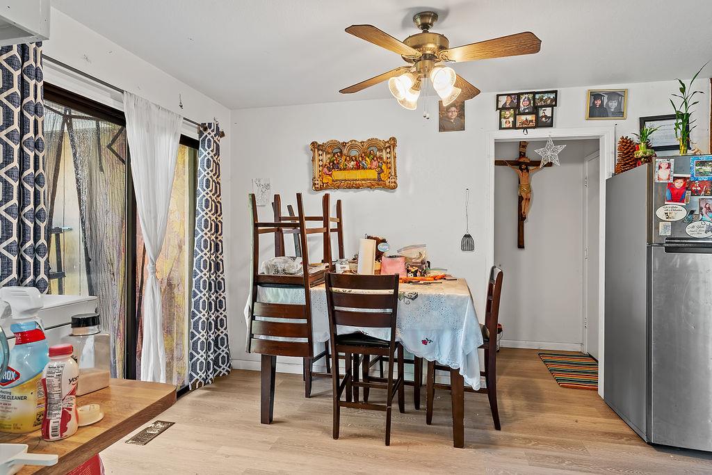 Irwin Lane Santa Rosa, CA 95401 - Photo 33 of 35 a view of a dining room with furniture and a chandelier fan
