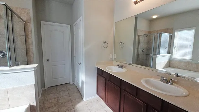 a bathroom with a double vanity sink mirror and double