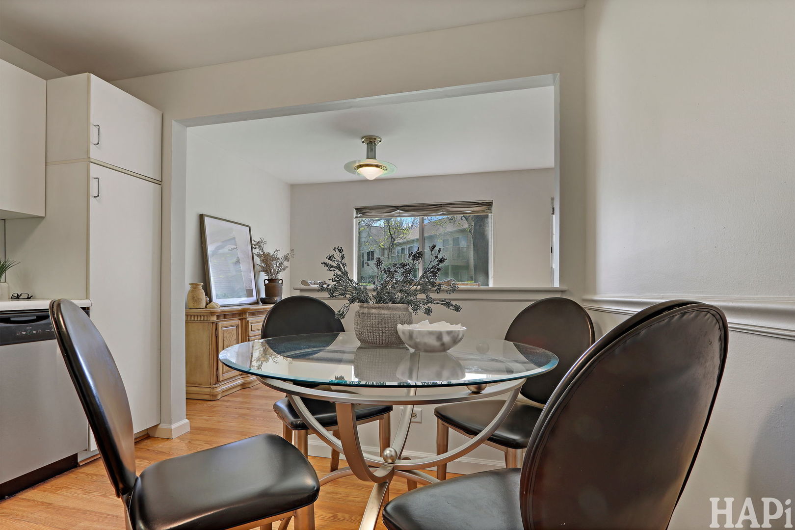 1402 Aldgate Court, Unit D1 Wheeling, IL 60090 - Photo 12 of 25 a dining room with furniture and window