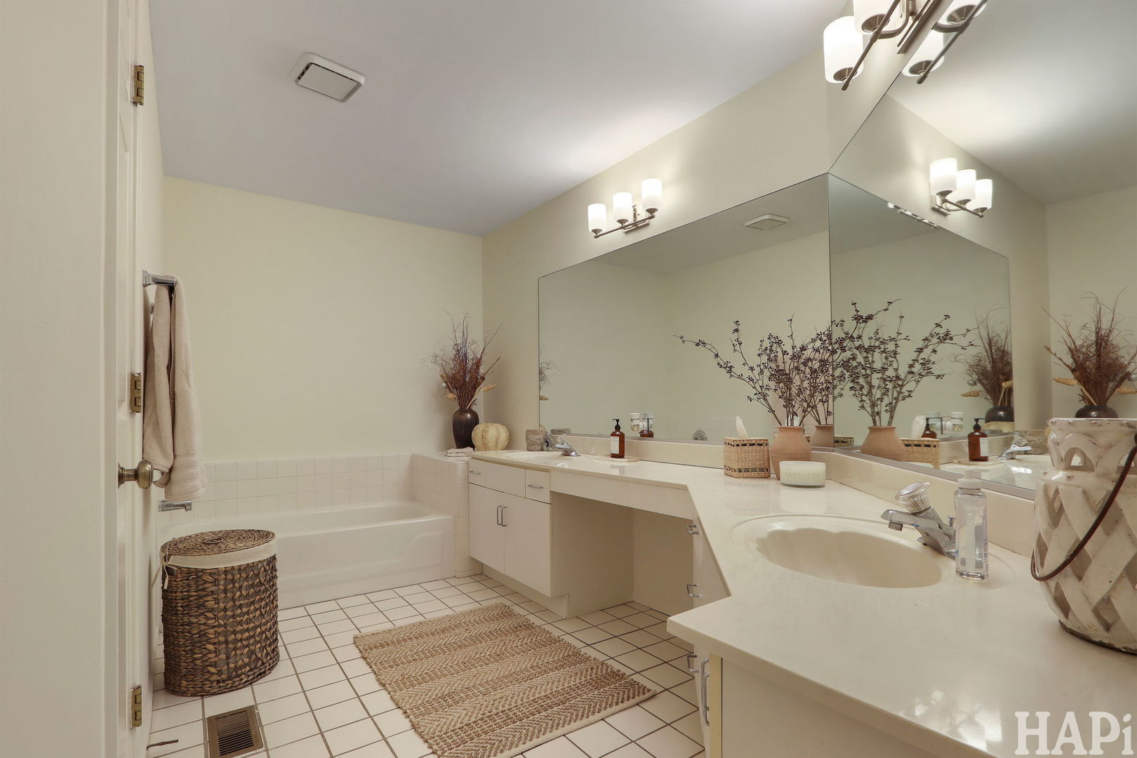 1402 Aldgate Court, Unit D1 Wheeling, IL 60090 - Photo 16 of 25 a bathroom with a tub sink and mirror