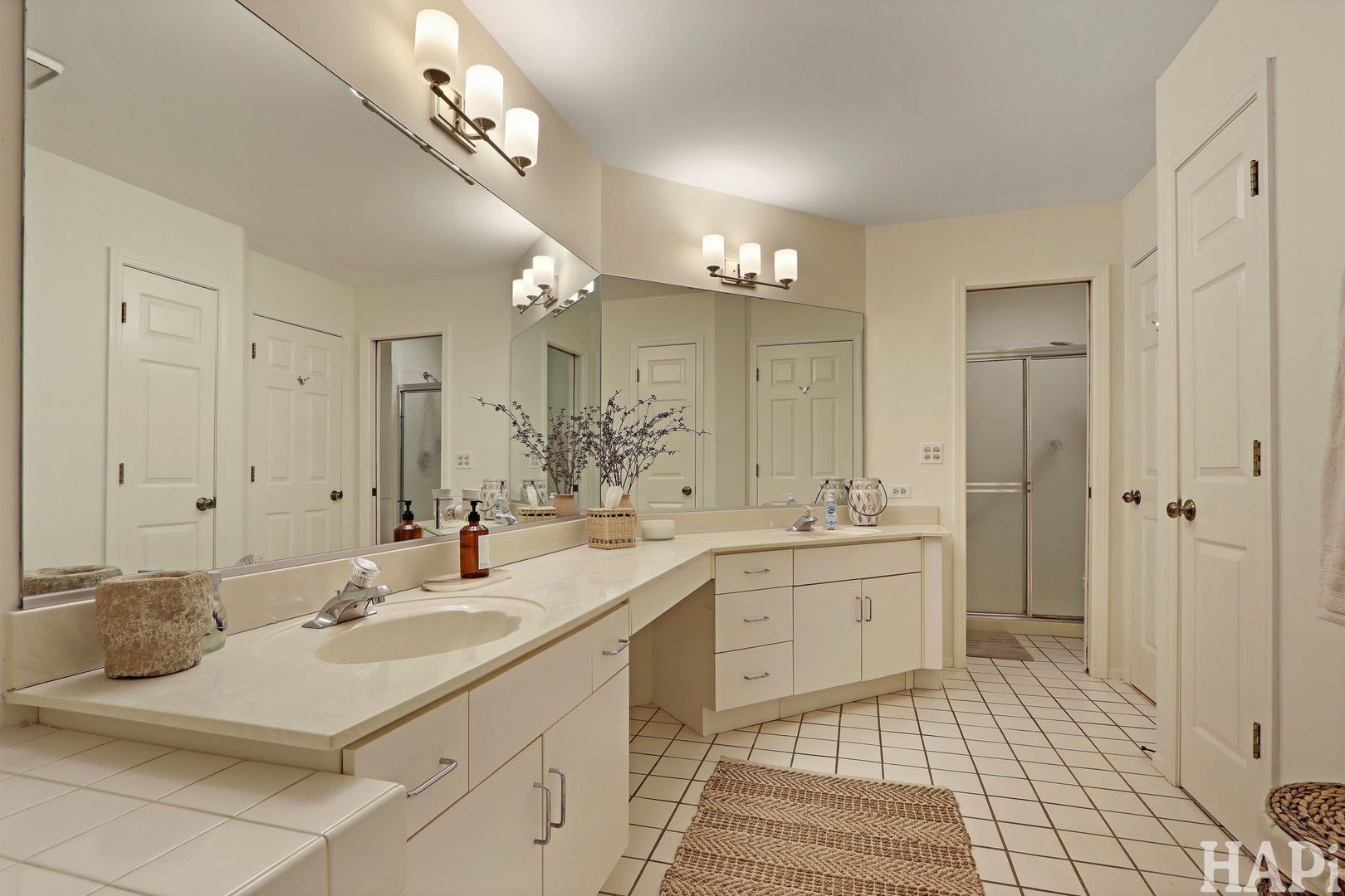 1402 Aldgate Court, Unit D1 Wheeling, IL 60090 - Photo 17 of 25 a spacious bathroom with a double vanity sink mirror and double