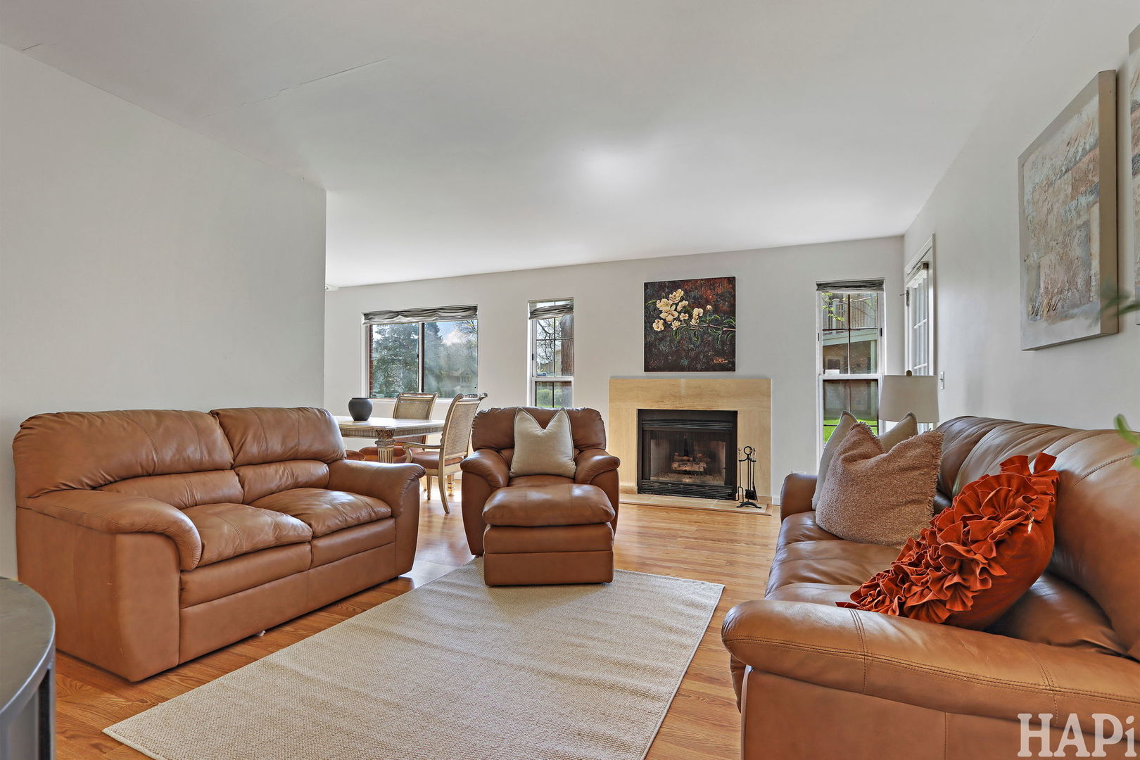 1402 Aldgate Court, Unit D1 Wheeling, IL 60090 - Photo 5 of 25 a living room with furniture a fireplace and a large window