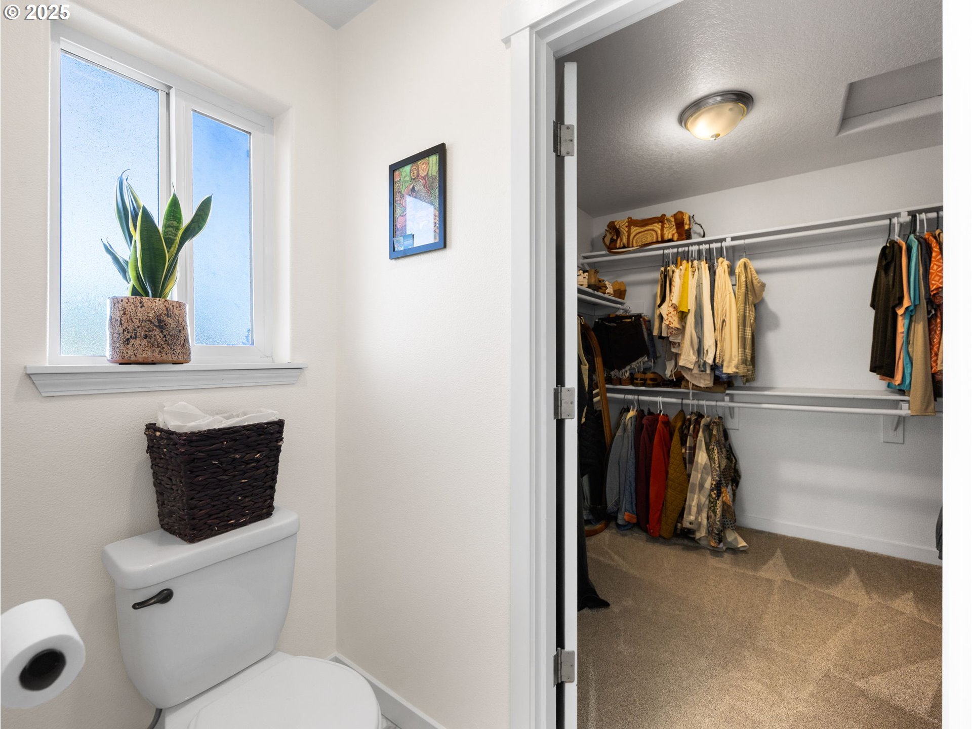 18254 Myra Court Sandy, OR 97055 - Photo 21 of 42 a bathroom with a toilet a sink and a mirror