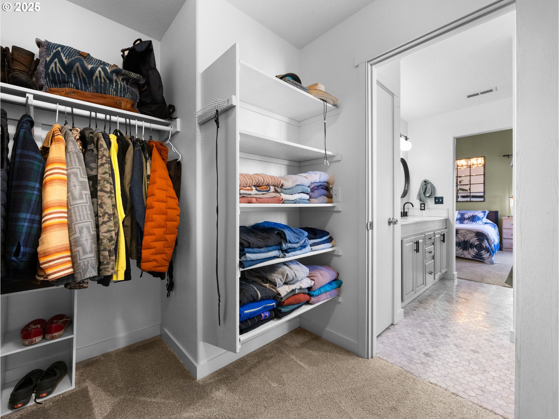 18254 Myra Court Sandy, OR 97055 - Photo 22 of 42 a view of walk in closet with clothes and shoes