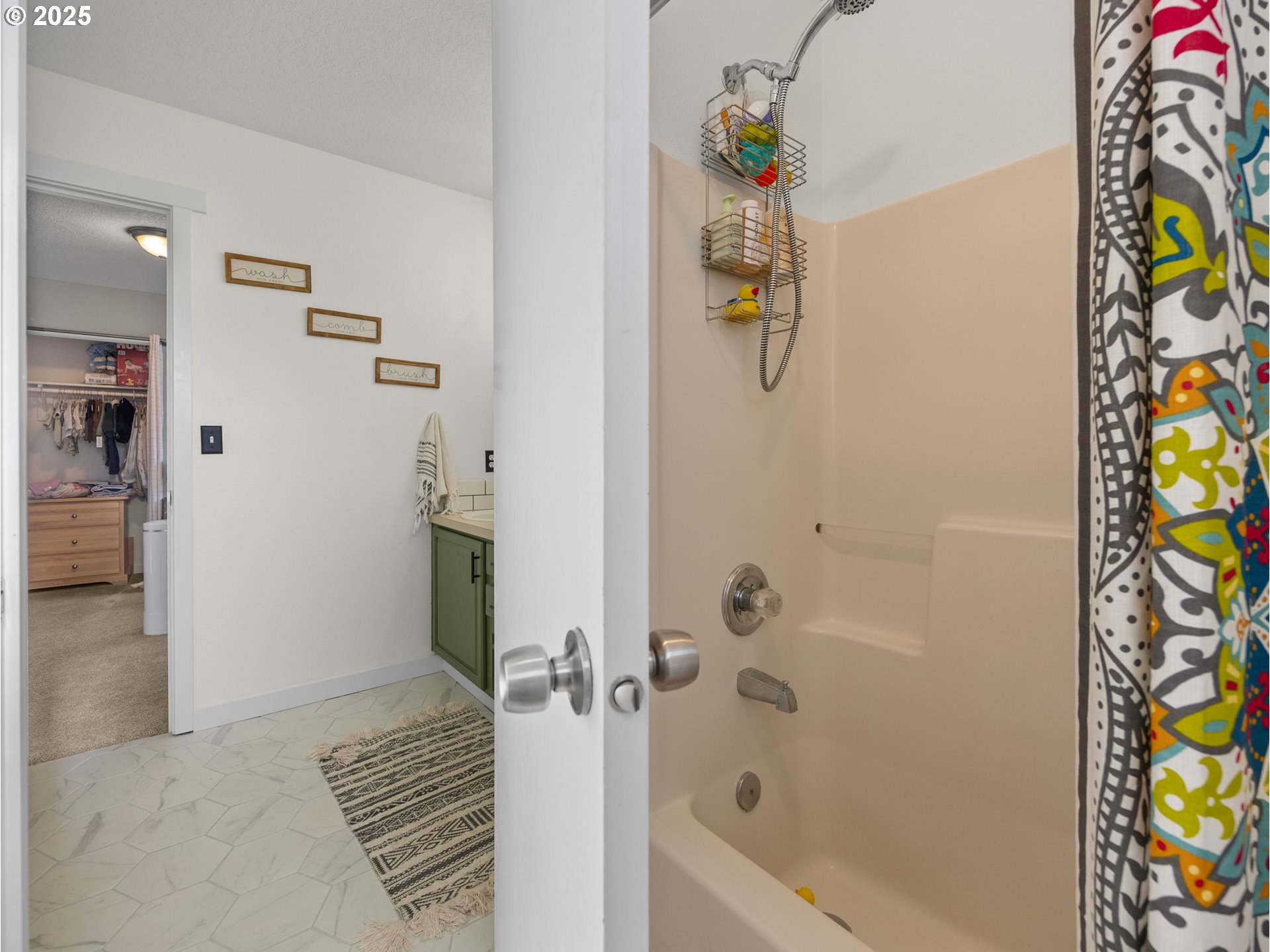 18254 Myra Court Sandy, OR 97055 - Photo 29 of 42 a bathroom with a bathtub and a shower