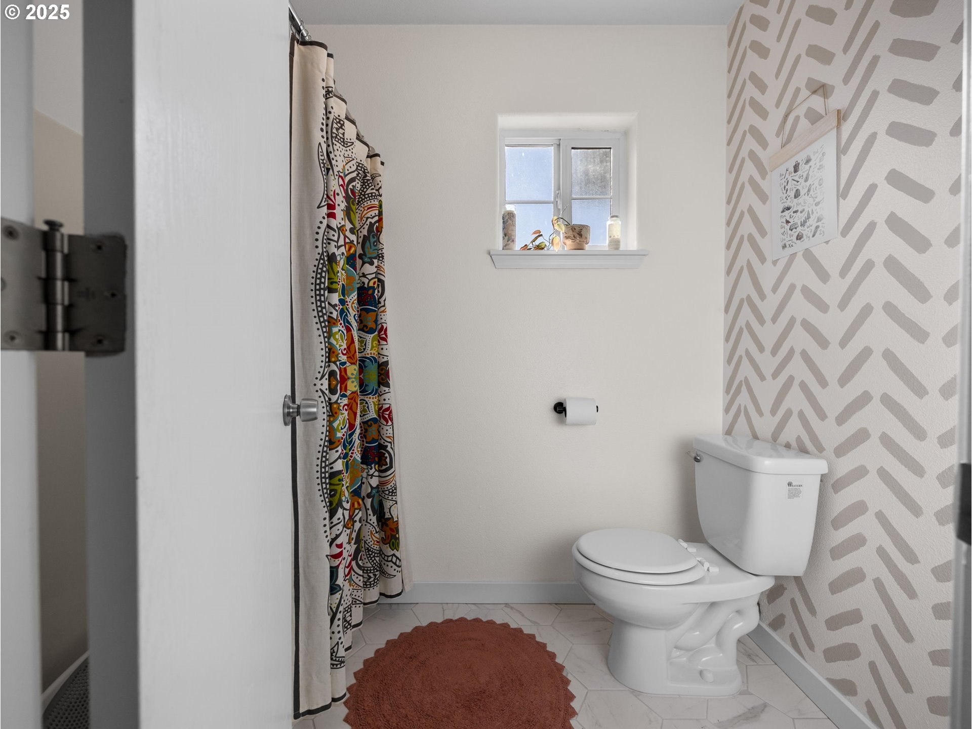 18254 Myra Court Sandy, OR 97055 - Photo 30 of 42 a white toilet sitting next to a shower curtain