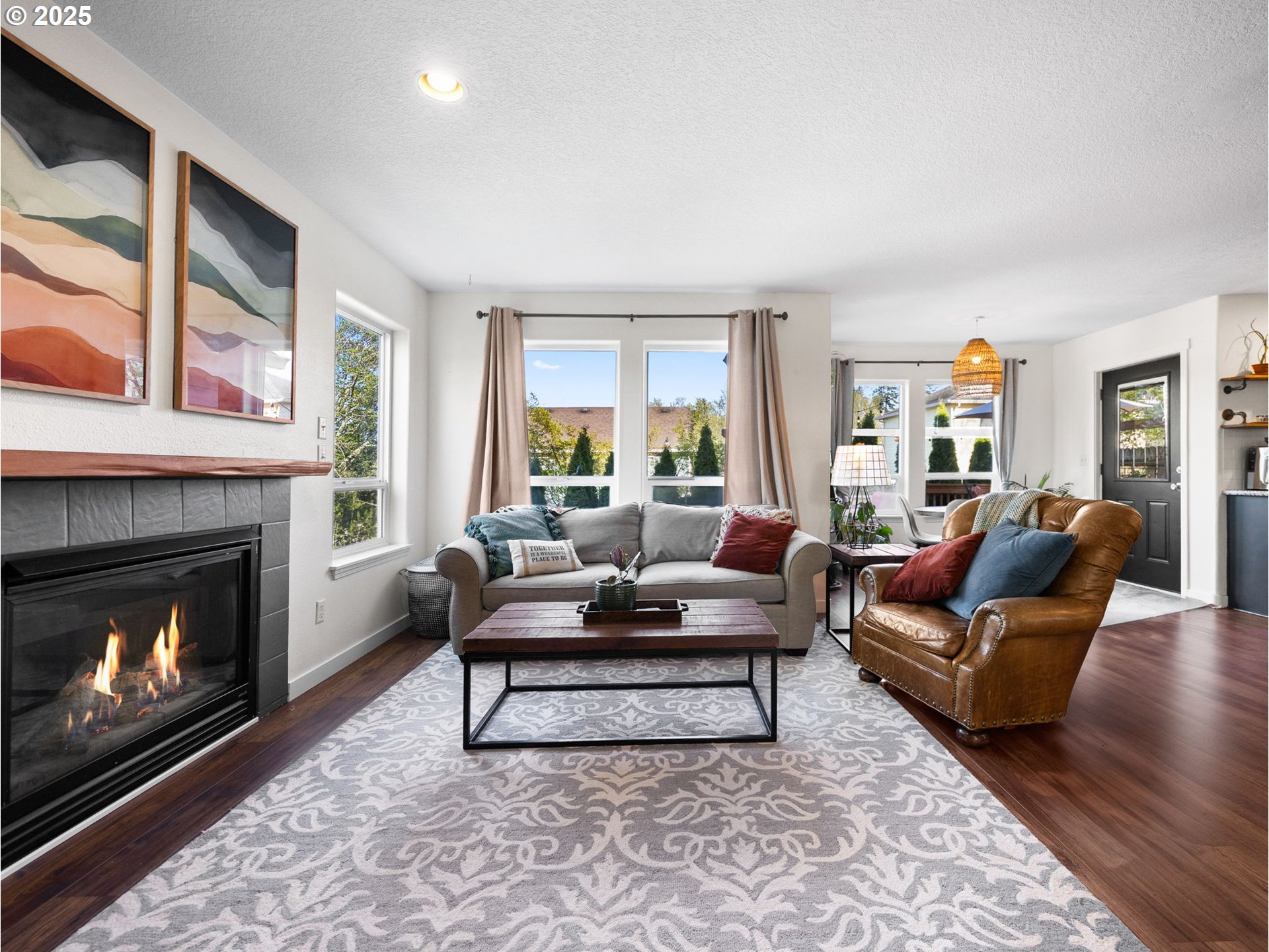 18254 Myra Court Sandy, OR 97055 - Photo 7 of 42 a living room with furniture and a fireplace