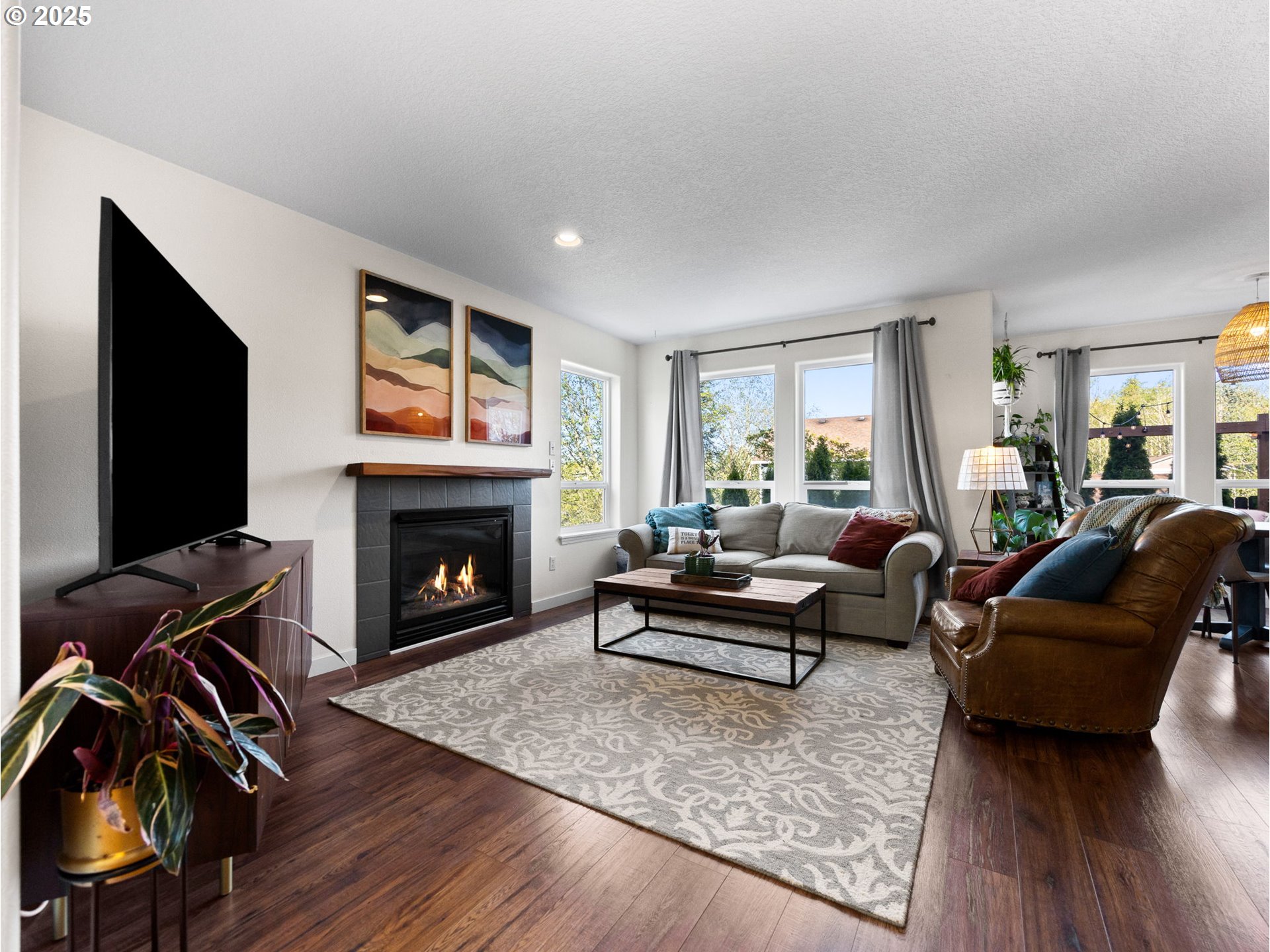 18254 Myra Court Sandy, OR 97055 - Photo 8 of 42 a living room with furniture and a fireplace
