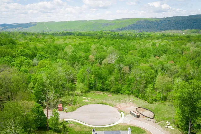 a backyard of a house with yard and outdoor seating