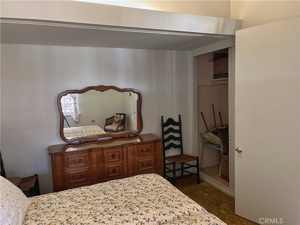 1075 Brookline Road Seal Beach, CA 90740 - Photo 13 of 13 a bedroom with a bed and a dresser