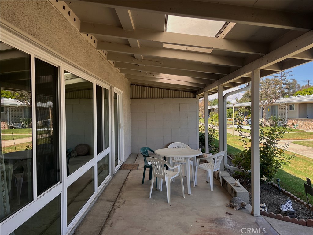 1075 Brookline Road Seal Beach, CA 90740 - Photo 3 of 13 a view of a porch with furniture and a yard