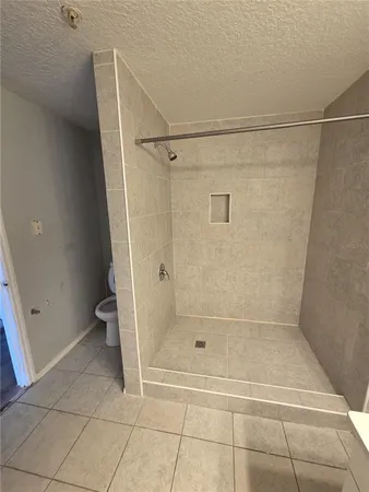 a bathroom with a bath tub and shower