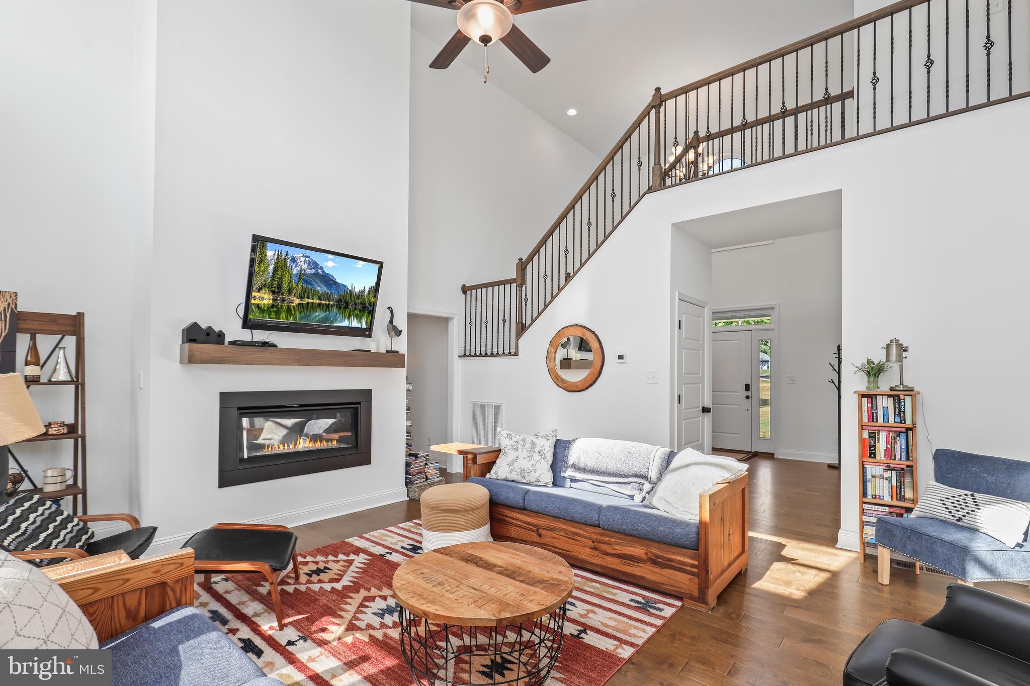 225 Raven Road Bumpass, VA 23024 - Photo 22 of 46 a living room with furniture and a fireplace