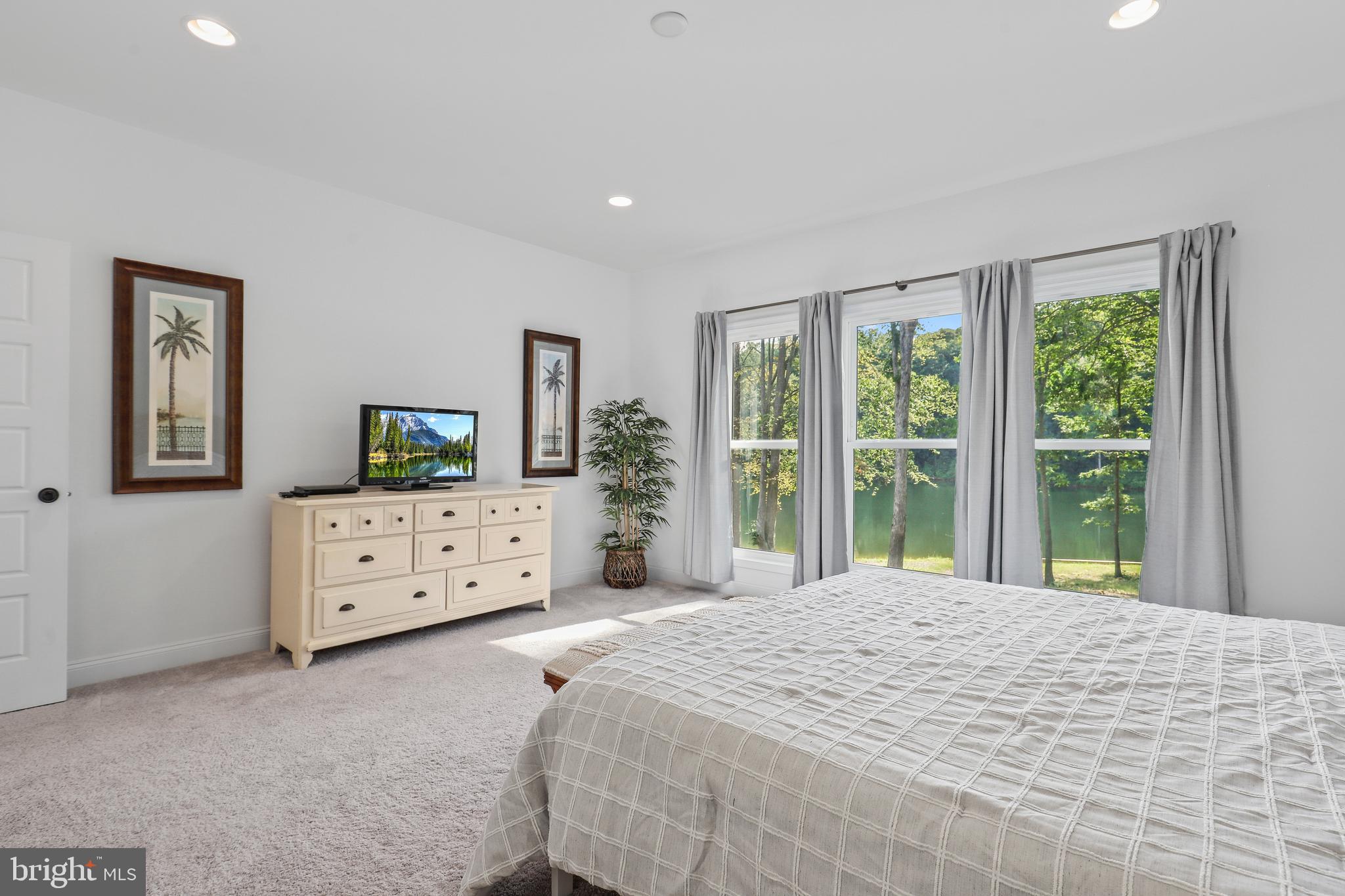 225 Raven Road Bumpass, VA 23024 - Photo 24 of 46 a bedroom with a bed and a window