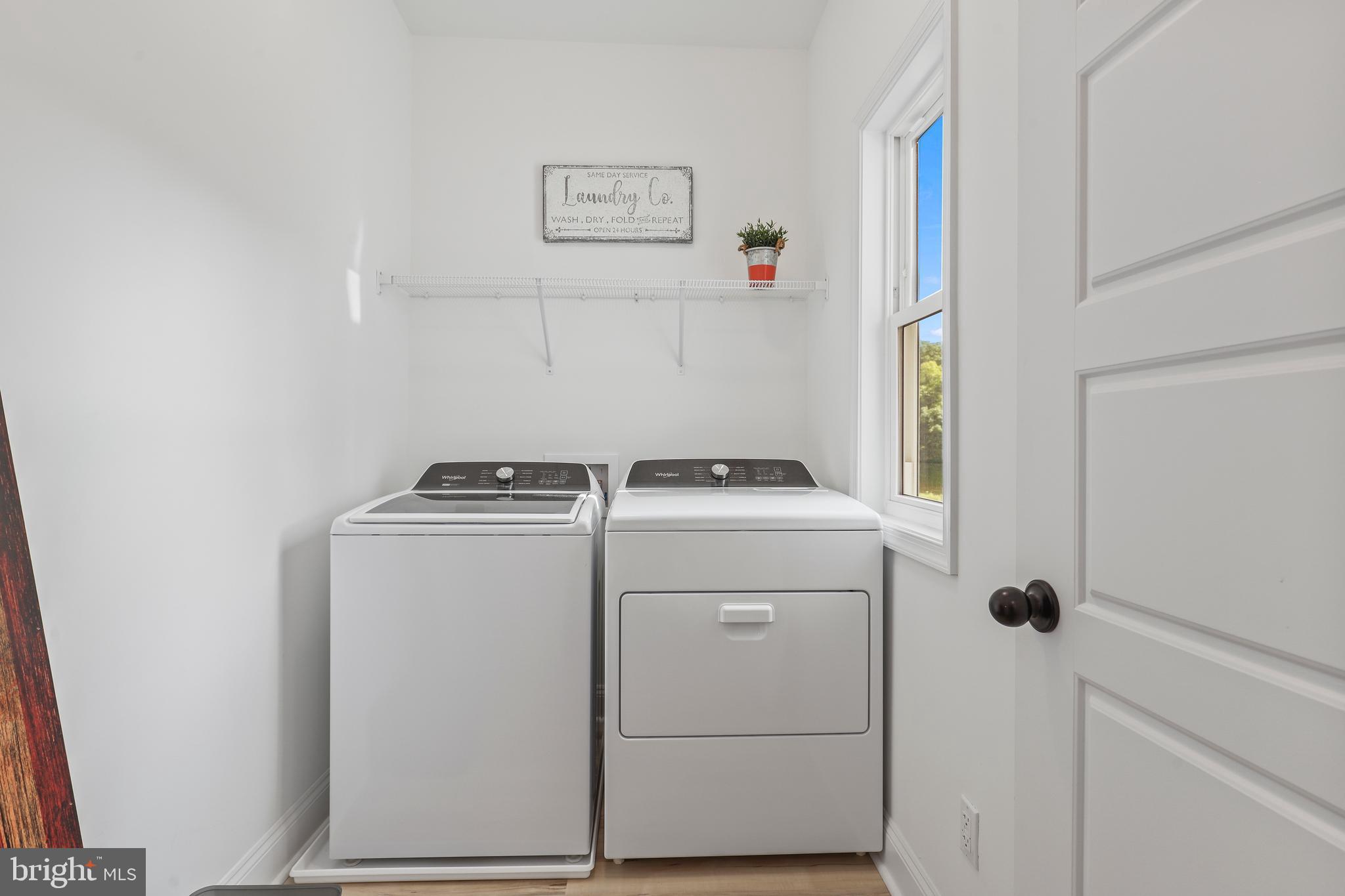 225 Raven Road Bumpass, VA 23024 - Photo 30 of 46 a view of storage and utility room with washer and dryer