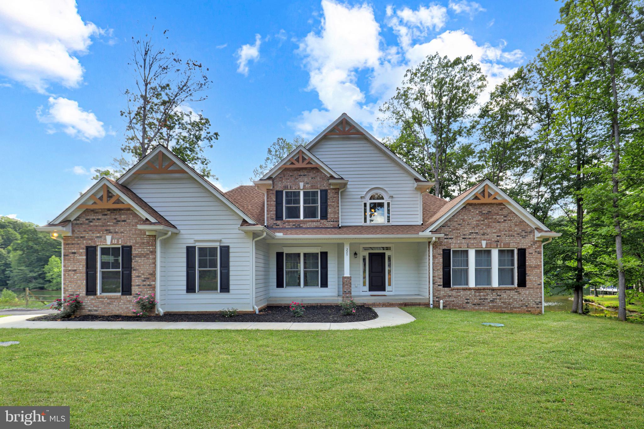225 Raven Road Bumpass, VA 23024 - Photo 41 of 46 a front view of a house with a garden