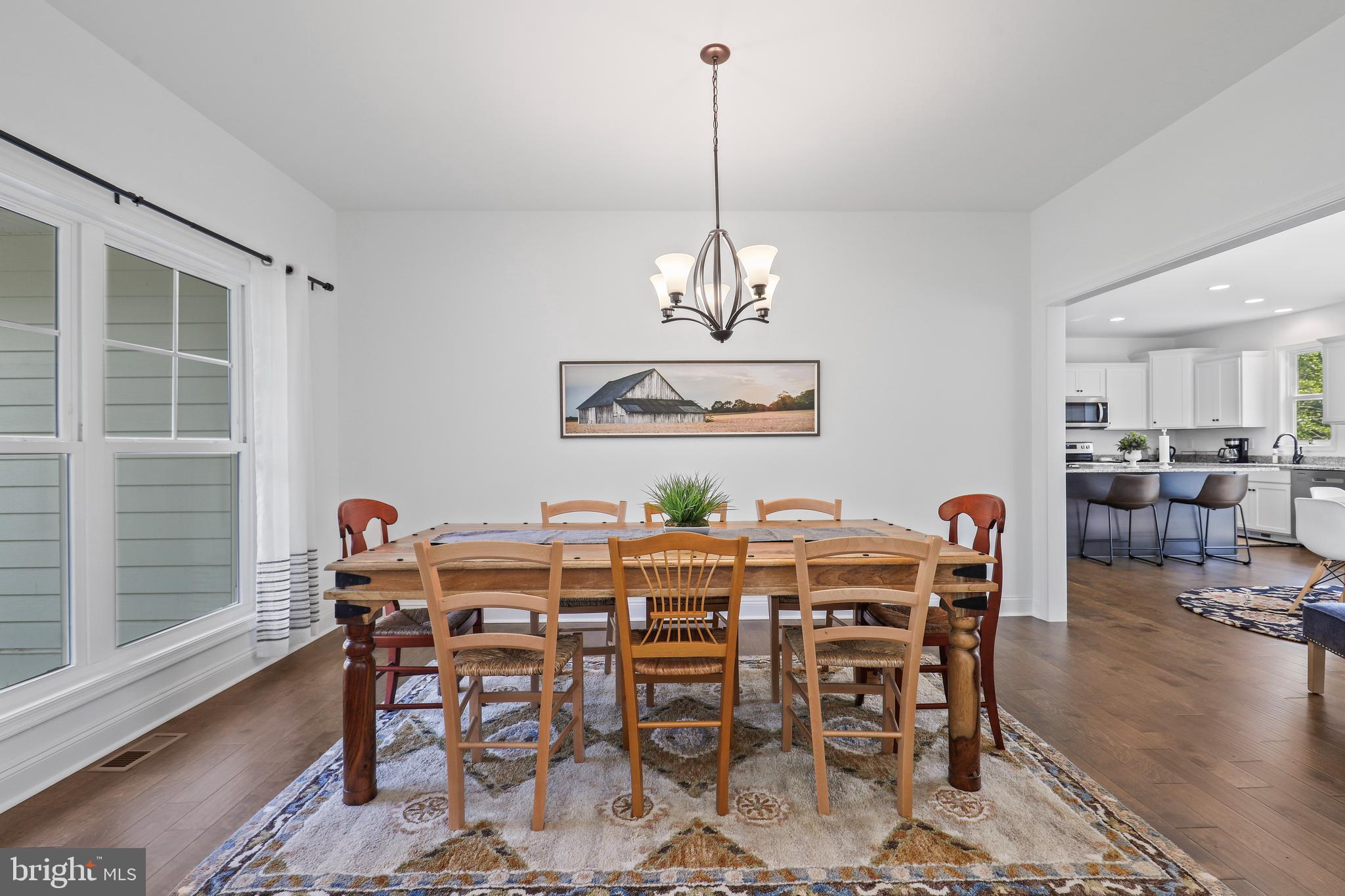 225 Raven Road Bumpass, VA 23024 - Photo 10 of 46 a view of a dining room with furniture window and wooden floor