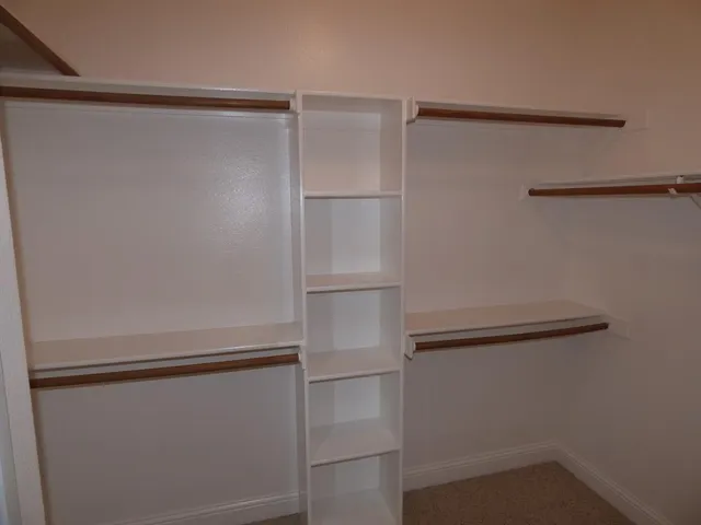 a view of an empty walk in closet