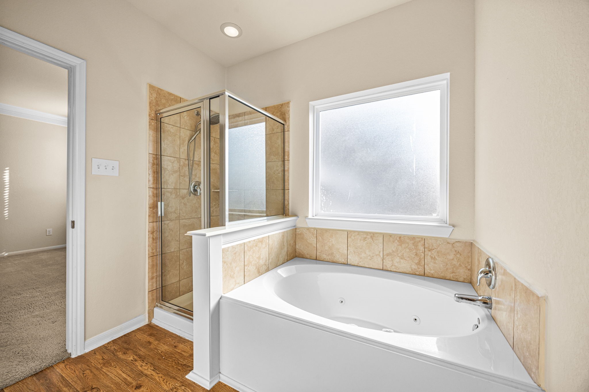 2922 Coachmaker Trail Rosenberg, TX 77471 - Photo 16 of 32 Primary bathroom features separate shower and soaking tub.