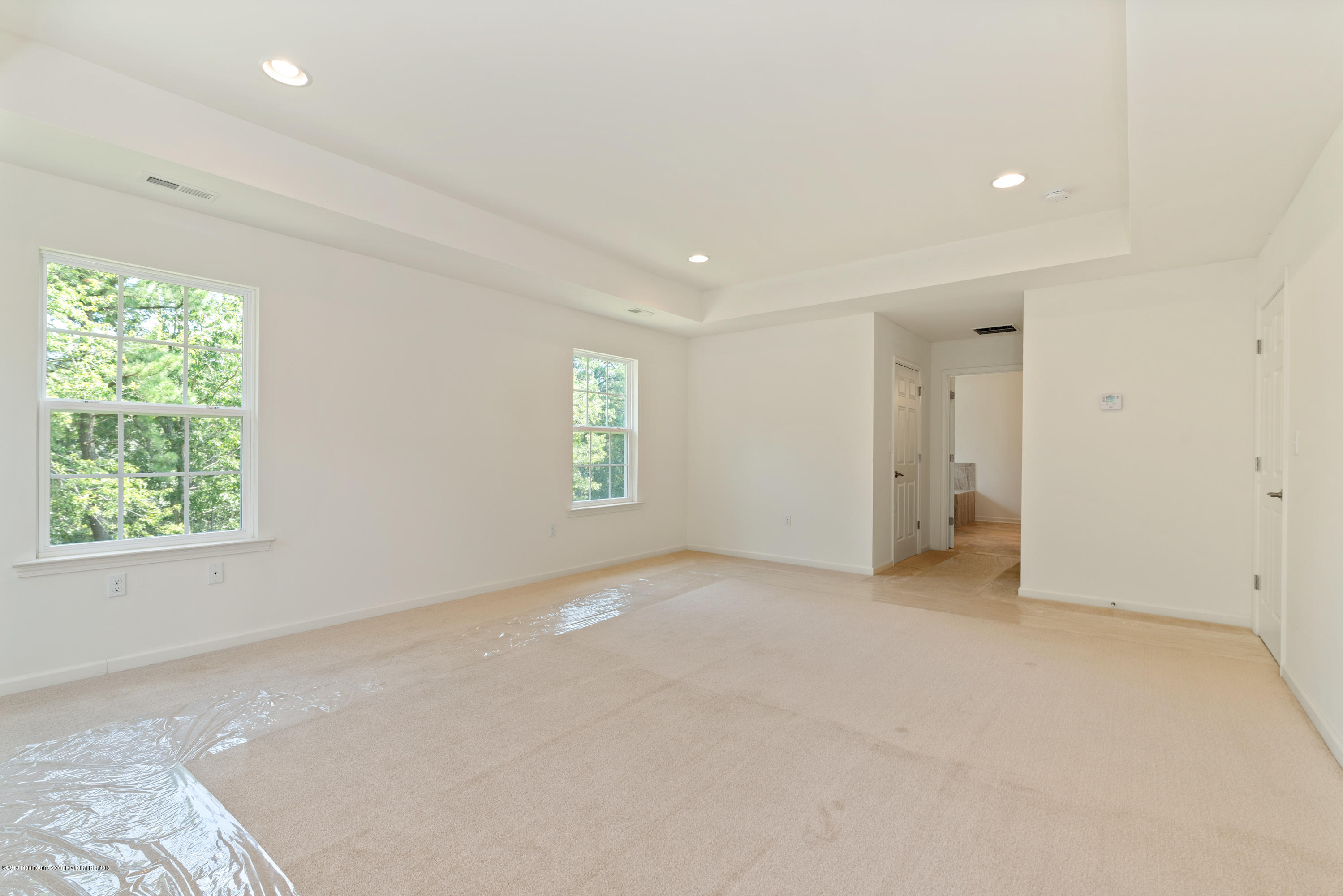 3 Bellagio Road Jackson, NJ 08527 - Photo 23 of 44 an empty room with windows