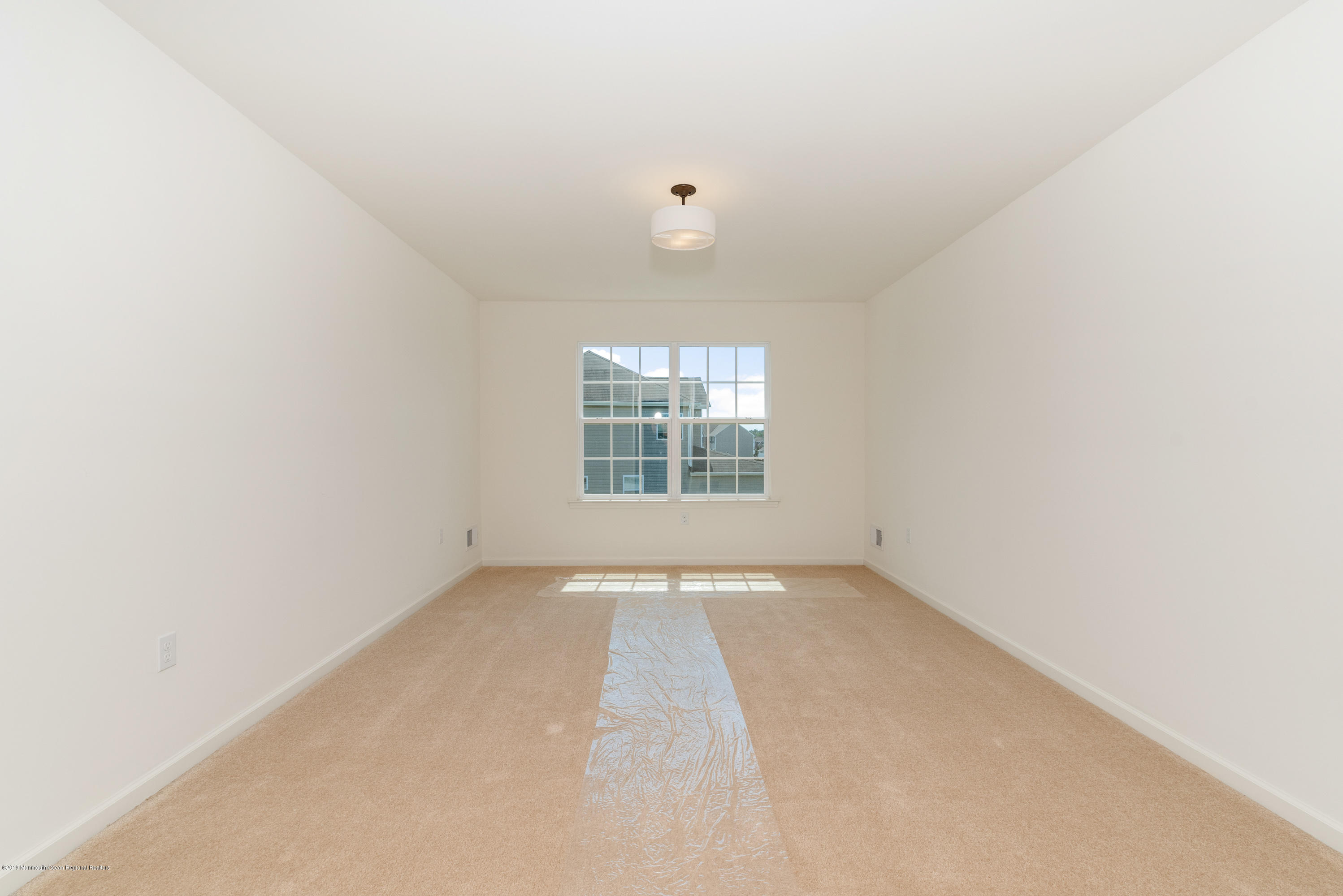 3 Bellagio Road Jackson, NJ 08527 - Photo 27 of 44 an empty room with windows