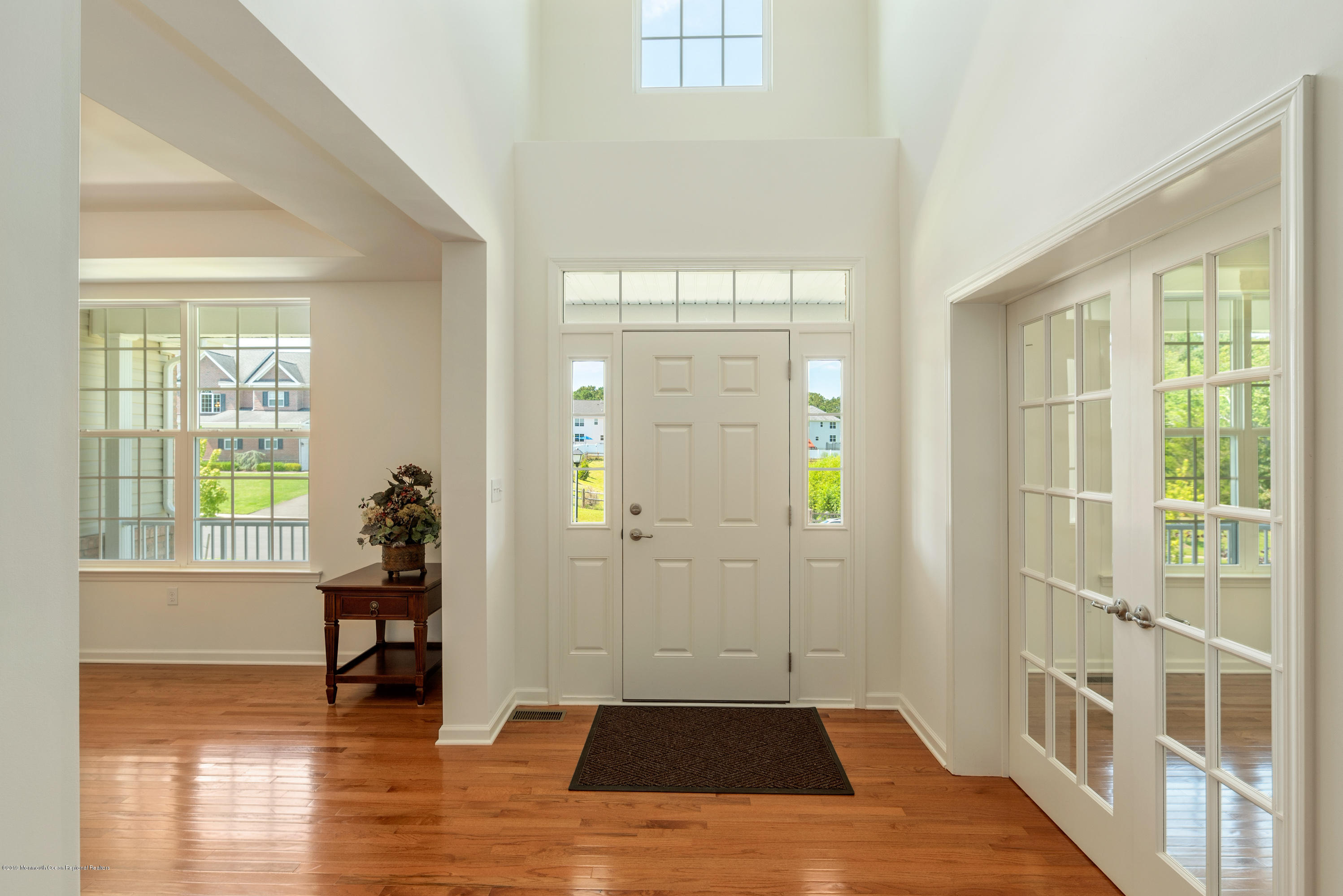 3 Bellagio Road Jackson, NJ 08527 - Photo 3 of 44 a view of an empty room with wooden floor and a window