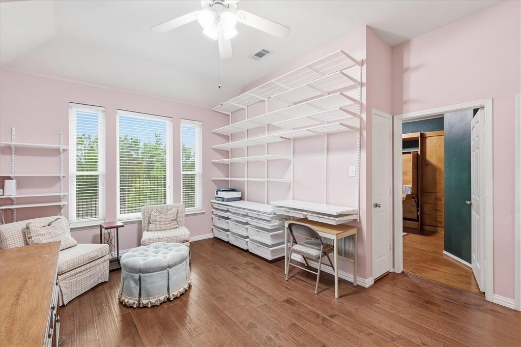 8409 Sequoia Way Fort Worth, TX 76137 - Photo 11 of 40 a bedroom with furniture and a wooden floor