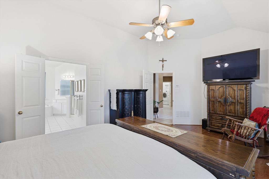 8409 Sequoia Way Fort Worth, TX 76137 - Photo 22 of 40 a bedroom with a bed and a flat screen tv