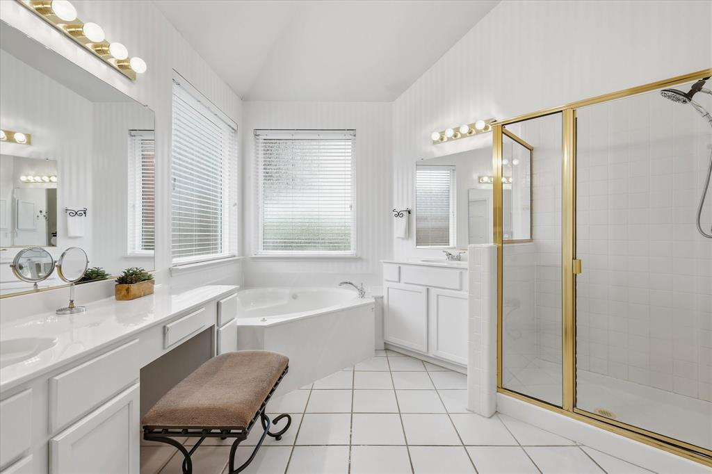 8409 Sequoia Way Fort Worth, TX 76137 - Photo 23 of 40 a bathroom with a tub sink and a mirror
