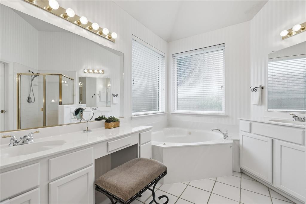 8409 Sequoia Way Fort Worth, TX 76137 - Photo 24 of 40 a bathroom with a sink double vanity mirror and a bathtub