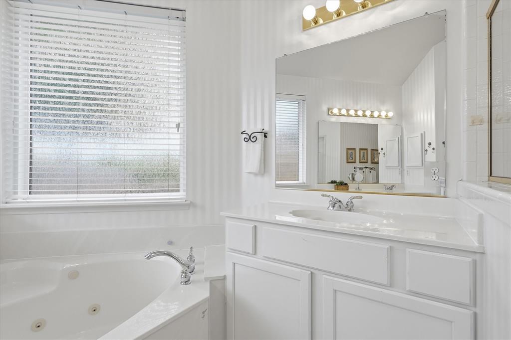 8409 Sequoia Way Fort Worth, TX 76137 - Photo 26 of 40 a bathroom with a bathtub and a sink