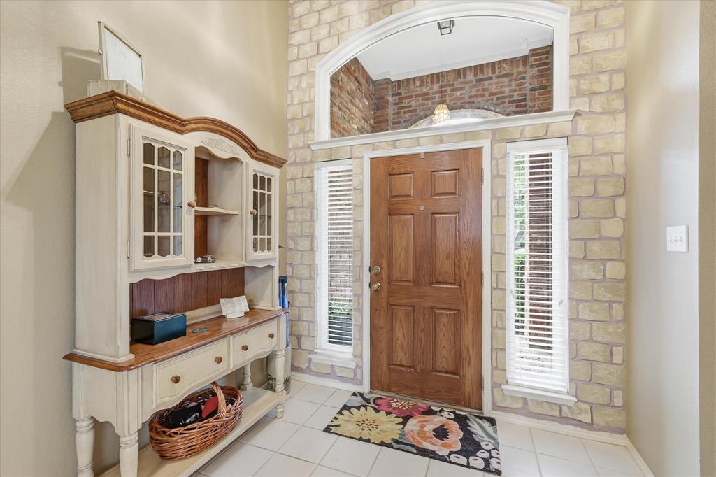 8409 Sequoia Way Fort Worth, TX 76137 - Photo 3 of 40 a front view of a house with entryway