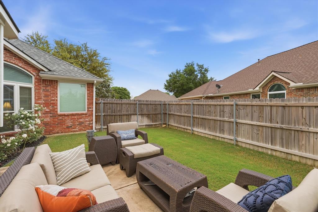 8409 Sequoia Way Fort Worth, TX 76137 - Photo 32 of 40 a view of a patio with couches chairs and a table and potted plants